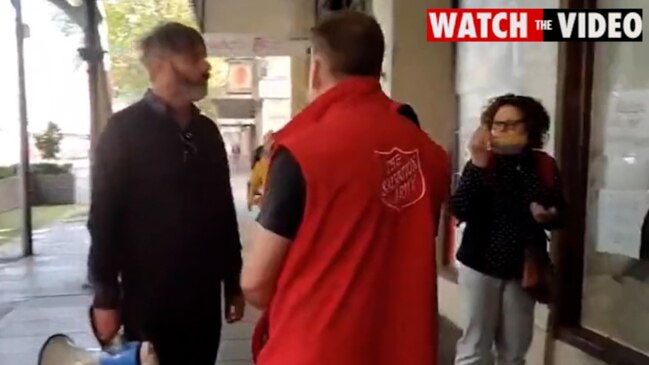 Anti-vaccination protesters confront Salvation Army staff