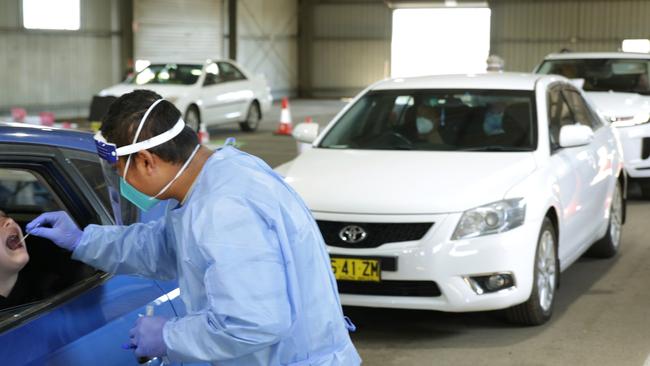 A child is tested for Covid at the Dubbo Showground drive-through clinic. Picture: Dean Marzolla.