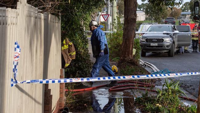 Police at the scene of the blaze in July last year. Picture: Brad Fleet