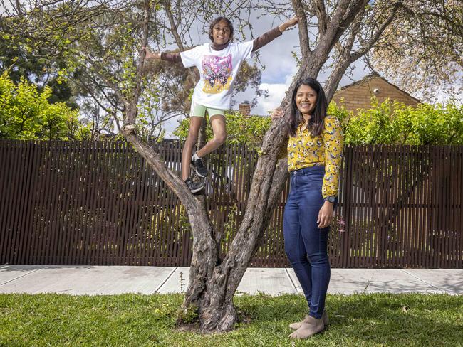 Chathu De Silva encourages her daughter, Nalia, to play outside. Picture: Wayne Taylor