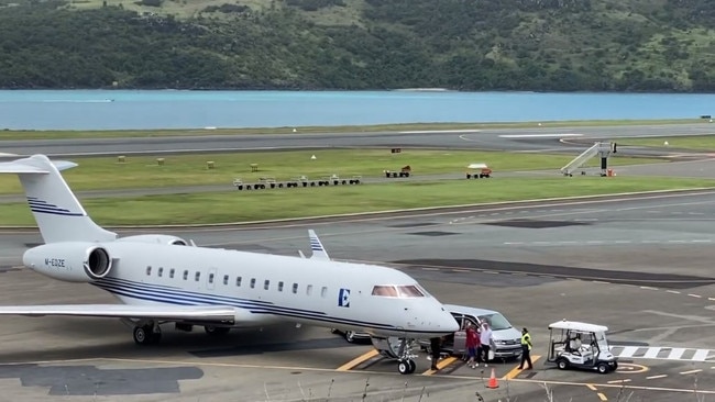 The couple infront of their private jet on Hamilton Island. Picture: Supplied