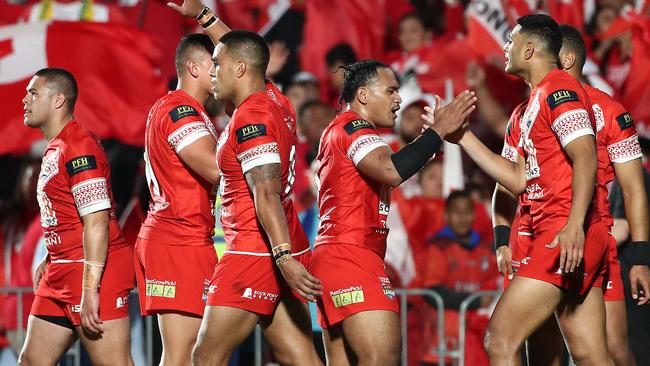 Tonga players celebrate a try during the Test match against Australia at Mt Smart Stadium in Auckland. Picture: AFP