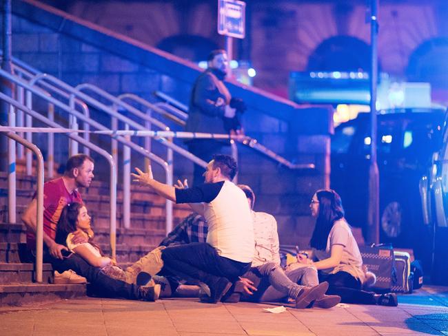 People at the scene near the Manchester Arena after reports of an explosion. Picture: Joel Goodman/LNP
