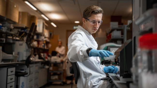 A vaccine technician works in the Covid lab at the University of Oxford’s Jenner Institute. Picture: AFP