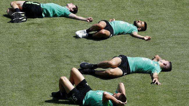 The Socceroos hold a training session at Stadium Trudovye Rezervy in Kazan after their 1-1 draw with Denmark in Samara yesterday. Players top to bottom Robbie Kruse, Aziz Behich, Tomas Rogic and Mark Milligan stretch during their training session. Picture: Toby Zerna