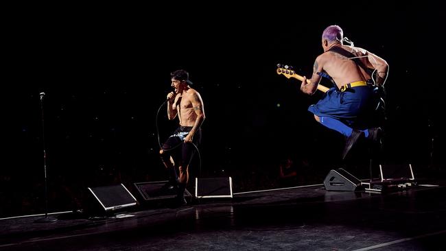 Flea jumping for joy with Anthony Kiedis, left, in Brisbane. Picture: David Mushegain