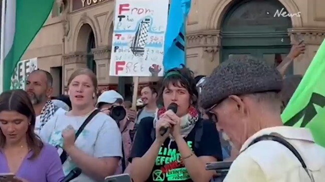 Climate protester on bail stands defiant at Flinders Street demonstration