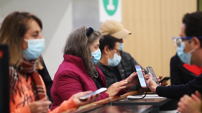 Arrivals to Hobart screened at Hobart Airport after Tasmania closed it's border with Victoria. Picture: Nikki Davis-Jones