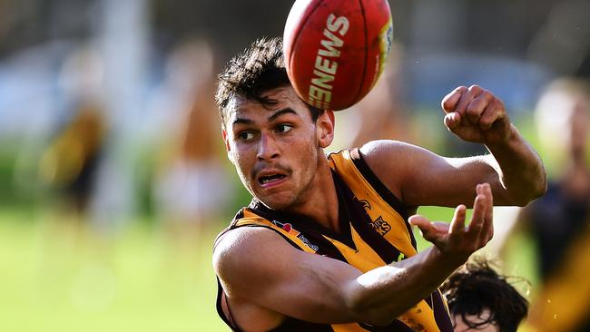 Darwin recruit Daniel Kaipara handballs during an Adelaide Football League match. Picture: Mark Brake