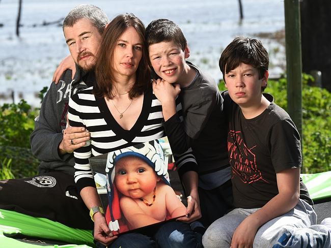 Tim Shaw and partner Kirstie, pictured with Alex, 10, and Eli, 13, have urged parents to ensure furniture is safely secured after their three-year-old son Blake. Picture: Rob Leeson