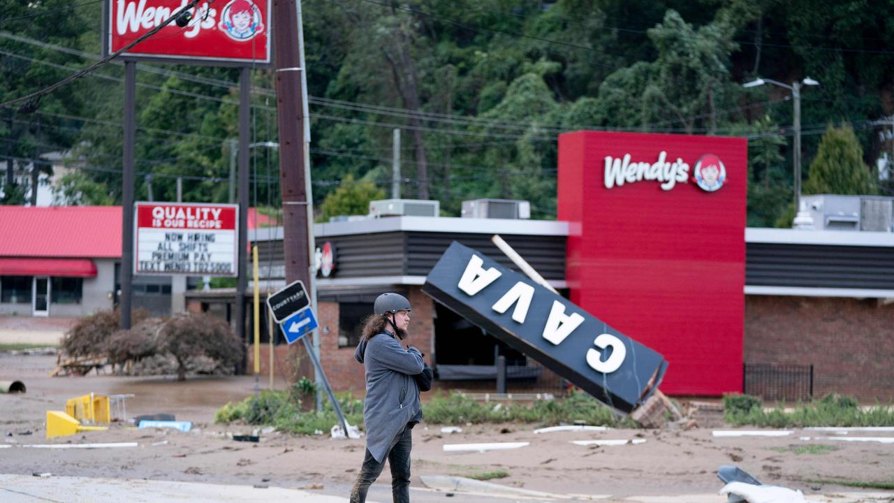 Asheville resident Kyle Gardner takes a look at damage in Biltmore Village in Asheville, North Carolina. Picture: Sean Rayford/Getty Images/AFP