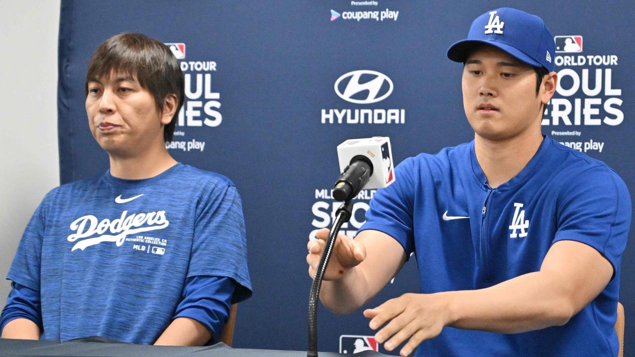Los Angeles Dodgers' Shohei Ohtani and his interpreter Ippei Mizuhara. Photo by Jung Yeon-je / AFP