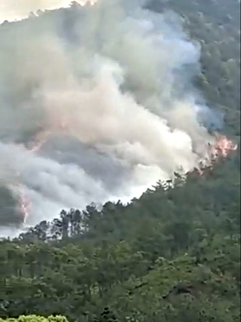 Fires were spotted on the Tengxian county mountainside after the plane crashed into the countryside. Picture: Twitter.