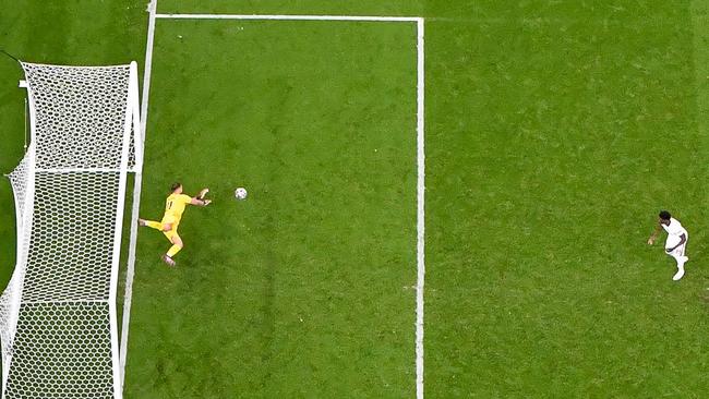 England's midfielder Bukayo Saka (R) fails to score past Italy's goalkeeper Gianluigi Donnarumma (L) in the penalty shootout during the UEFA EURO 2020 final.