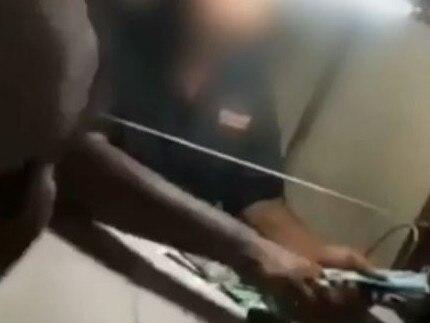 The currency exchange teller was accused of ripping off the tourist.