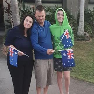 Tanya Glancy and family on their driveway at Logan.