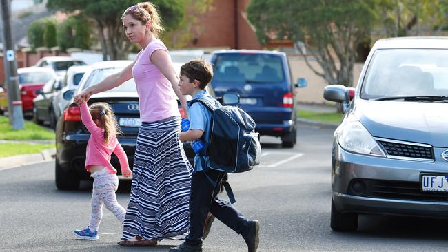 Emmaline Martin, pictured with her children Layla and Jude, says a crossing would make a big difference at Birralee Primary School. Picture: Josie Hayden