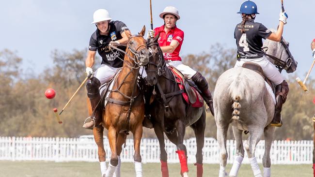 Billy Slater and Hugh Bowman battled it out at the Pacific Fair Magic Millions Polo. Picture: Luke Marsden