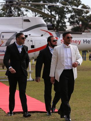 Auburn deputy mayor Salim Mehajer holds a lavish wedding in Lidcombe which involved helicopters, supercars, motorbikes, fighter jets a d dancing drummers and closed off Frances St. Salim is all smiles after he and his groomsmen arrived at Phillips Park by helicopter. picture: Toby Zerna