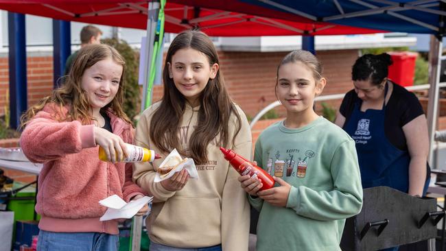 2024 Tasmanian State Election. Year 6 students at Sacred Heart College, Charlotte Evans, Lucy Nelson and Danijela Krajnovic who are raising money for their trip to Canberra. Picture: Linda Higginson