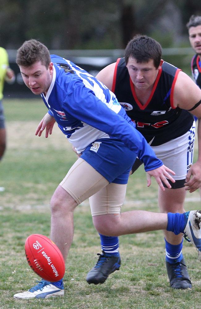 Scott Puxley (front) battles for possession this year against Broadford. Picture: Hamish Blair