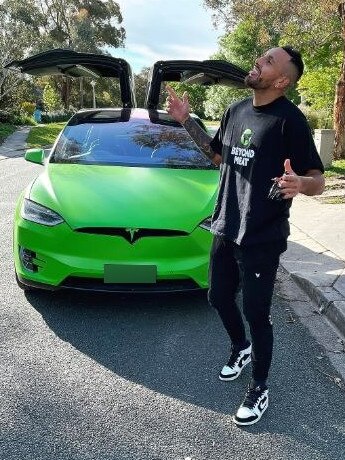 Kyrgios with his bright green Tesla. Picture: Instagram