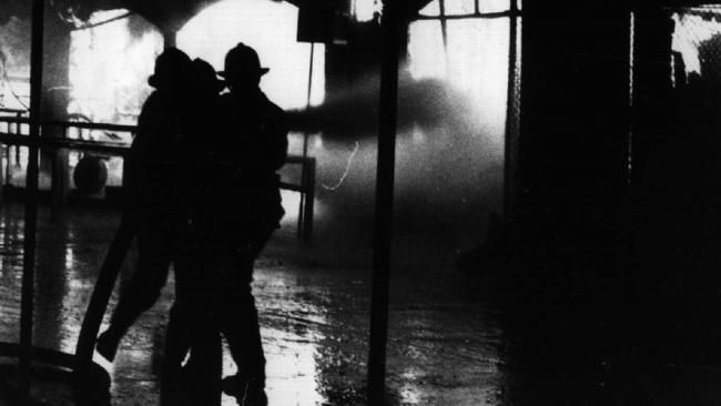 Firefighters fight a blaze in a ghost train ride at Luna Park in Sydney in 1979 which killed six children and one adult.