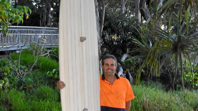 Steve McGinley hand crafted this timber surfboard as a unique feature to the shower at the end of the boardwalk. Picture: Caitlin Zerafa