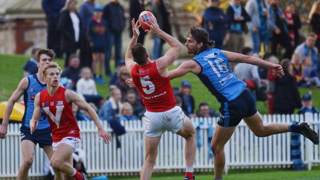 North's Cameron Craig marks ahead of Sturt’s Josh Patullo at Unley Oval in April. Picture: AAP/Brenton Edwards