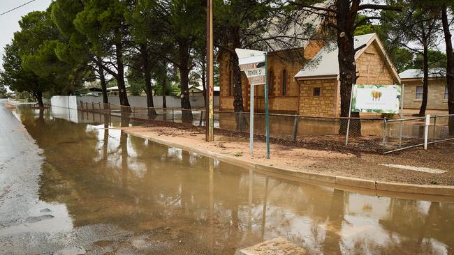 Water floods the streets of Morgan on Sunday. Picture: Matt Loxton