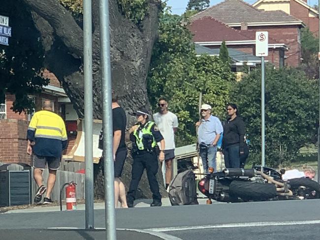 Police and emergency services are on the scene of a crash involving a motorbike at the intersection of Risdon Road and Swanston Street in New Town.