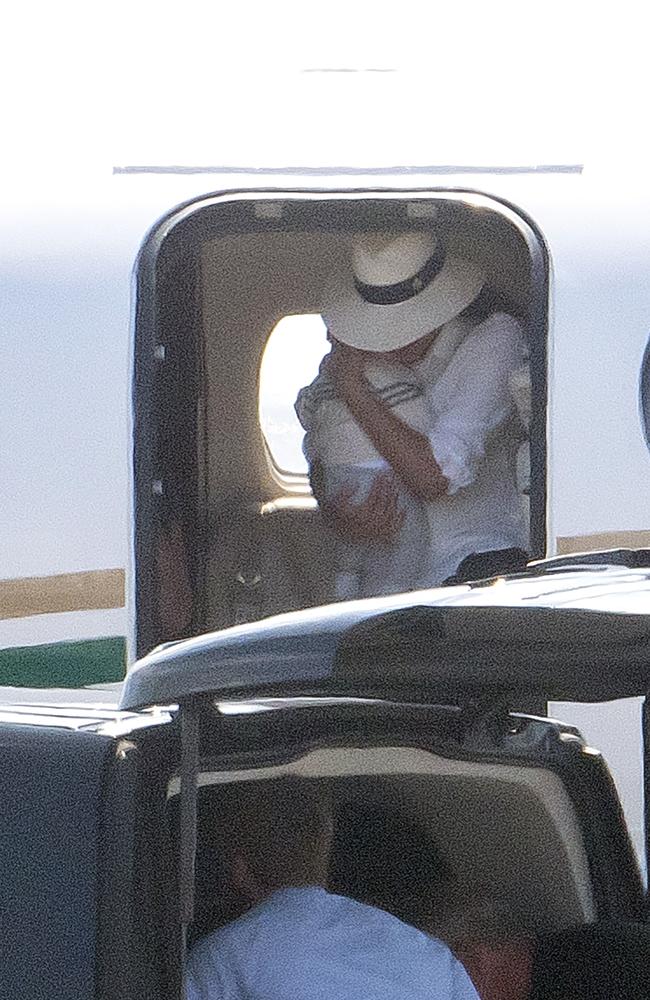 Meghan Markle cradling baby son Archie as she leaves a luxury private in France. Picture: EliotPress/MEGA TheMegaAgency.com