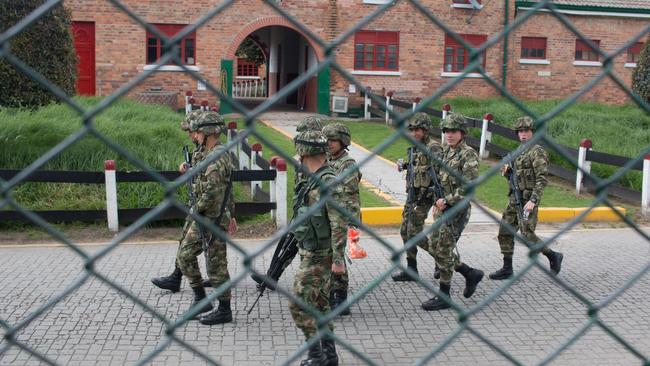 Soldiers on patrol in El Buena Pastor prison. Picture: Joe Parkin Daniels