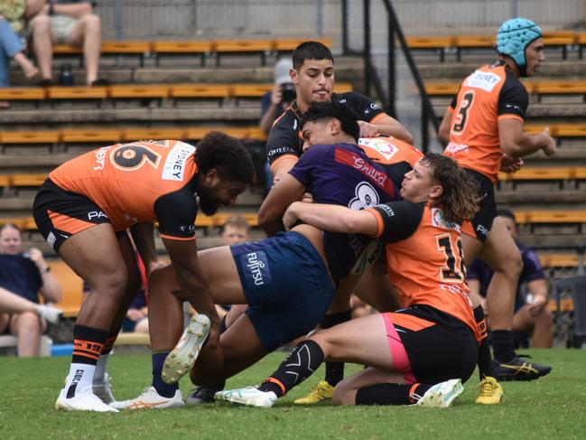 Suli Pole is tackled by a wall of Tigers defenders. Picture: Sean Teuma