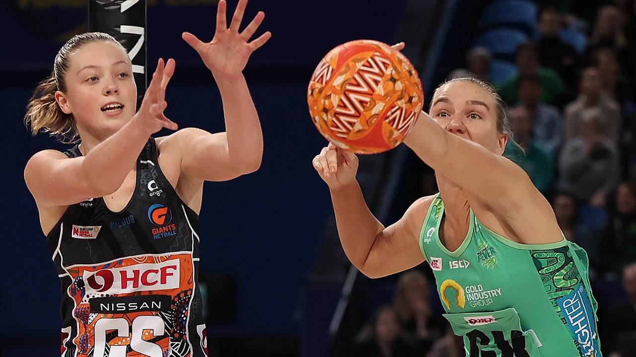 Courtney Bruce (right) shows why she led Super Netball in deflections and gains in season 2021 with this effort against Giants goaler Sohpie Dwyer. Photo: Getty Images