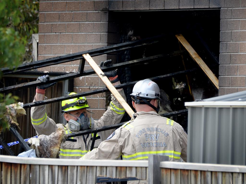 Emergency service crews at a property. Picture: Andrew Henshaw