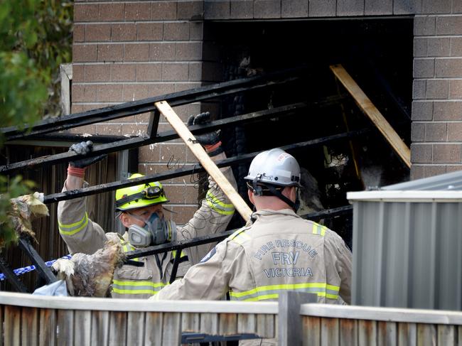 Emergency service crews at a property. Picture: Andrew Henshaw