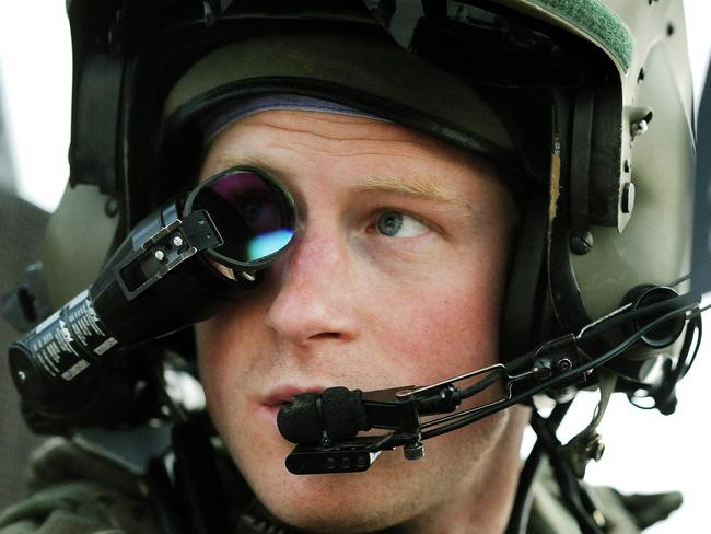 This picture taken on December 12, 2012 shows Britain's Prince Harry wearing his monocle gun sight as he sits in the front seat of his Apache Helicopter at the British controlled flight-line at Camp Bastion in Afghanistan's Helmand Province, where he was serving as an Apache Helicopter Pilot/Gunner with 662 Sqd Army Air Corps. Britain's Prince Harry confirmed he killed Taliban fighters during his stint as a helicopter gunner in Afghanistan, it can be reported after he completed his tour of duty on January 21, 2013.  AFP PHOTO / POOL / JOHN STILLWELL