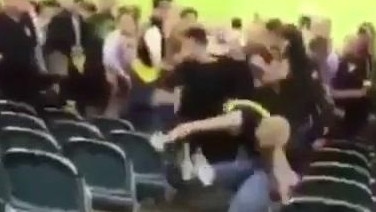 The AFL's season opener has been marred by an ugly brawl between footy fans.