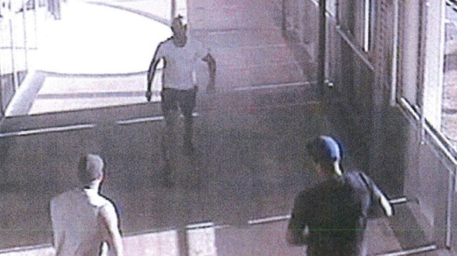 Images taken from the security camera shows a group of alleged bikies stalking a shooting victim down a hallway. Picture: Queensland Police Service