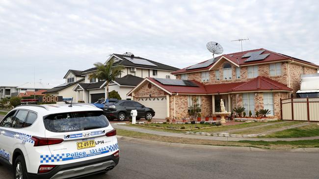 Police outside the family’s Green Valley home this week. Picture: Jonathan Ng