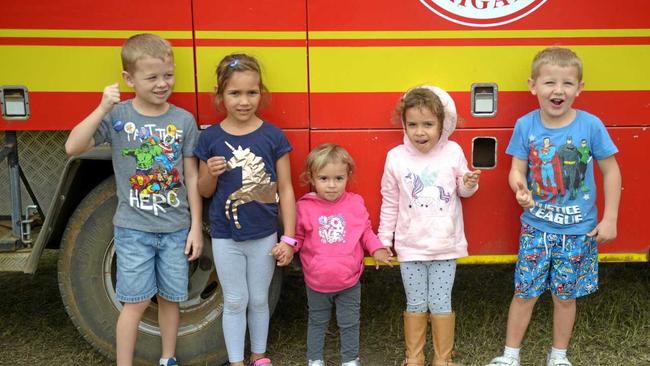 Schoolfriends Hunter Arnold; Marhella, Ma'rea and Macie Purcell; and Tyson Arnold 'ding the bell' at the Heritage Village's fire truck. Picture: Jann Houley