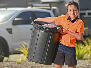 SMART SAVER: He's too young to get a job, but Cooper Riri, 8, has been doing rubbish runs with his father, Karl Riri, since mid-2018 to trade in his neighbours' rubbish for cash. Picture: Cordell Richardson