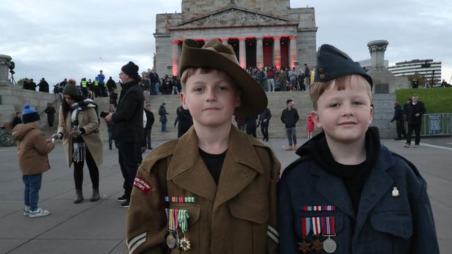 Braydin Harrison representing his grandfather’s service in the Vietnam War and Saxon Harrison representing his great-grandfather who served in WWII. Picture: NCA NewsWire / David Crosling