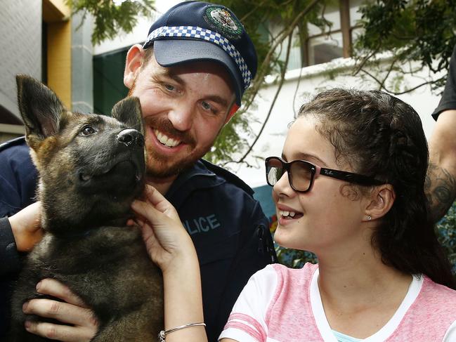 Senior constable Mark Wilkins and Children's Hospital patient Tahlia Borg. Picture: John Appleyard