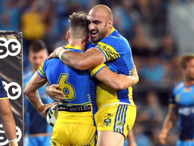 Tim Mannah (right) and Clint Gutherson celebrate a try.