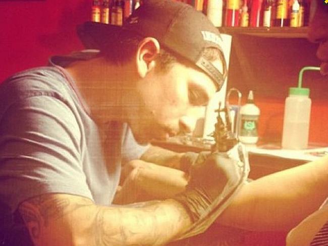 At work...New York tattoo artist Alex has outraged animal lovers by inking his pet dog Zion. Picture: Instagram