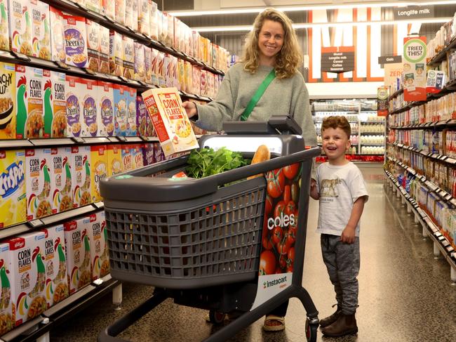 Melbourne mum Rebecca Karo and son Imri with the Coles smart trolley. Picture: NewsWire Handout