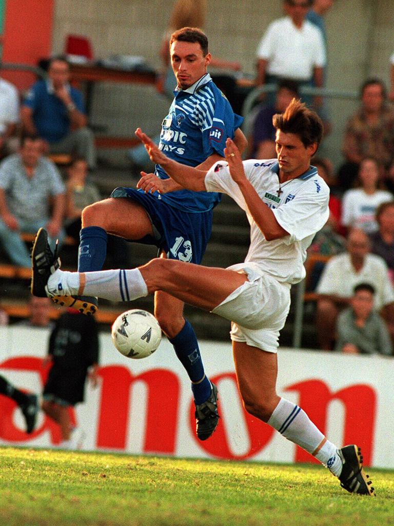 Sydney Olympic's Ante Juric and South Melbourne's Ivan Kelic fight for the ball at a NSW game in 1995.