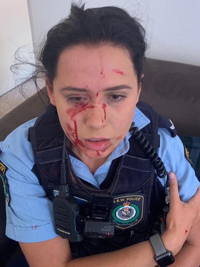 A man allegedly assaulted a female police officer was out on parole when the violent attack occurred.